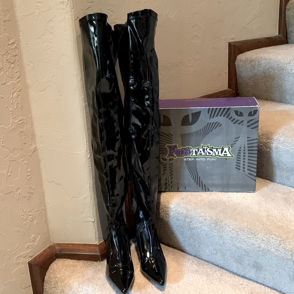BRAND NEW pair of super sexy thigh high black patent leather boots. Size 7.